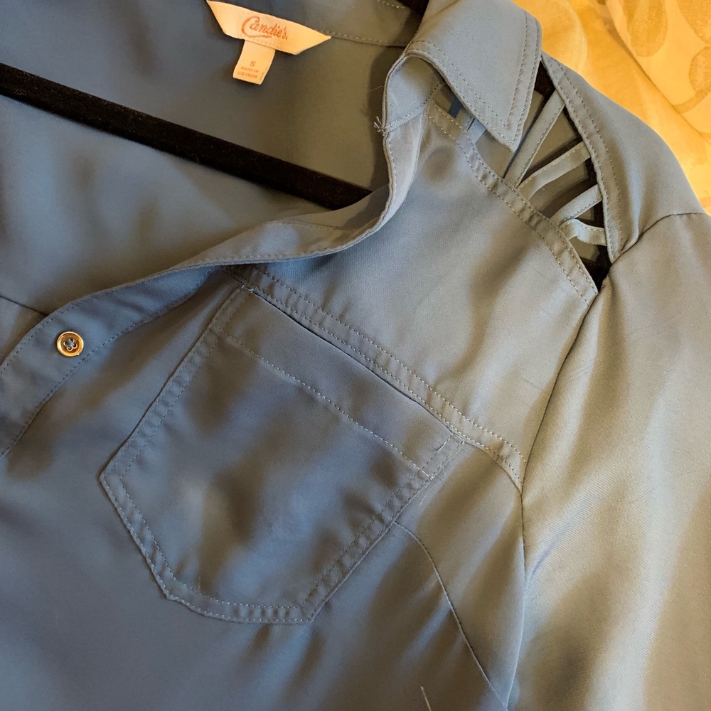 Flowy blue button up roll tab shirt.